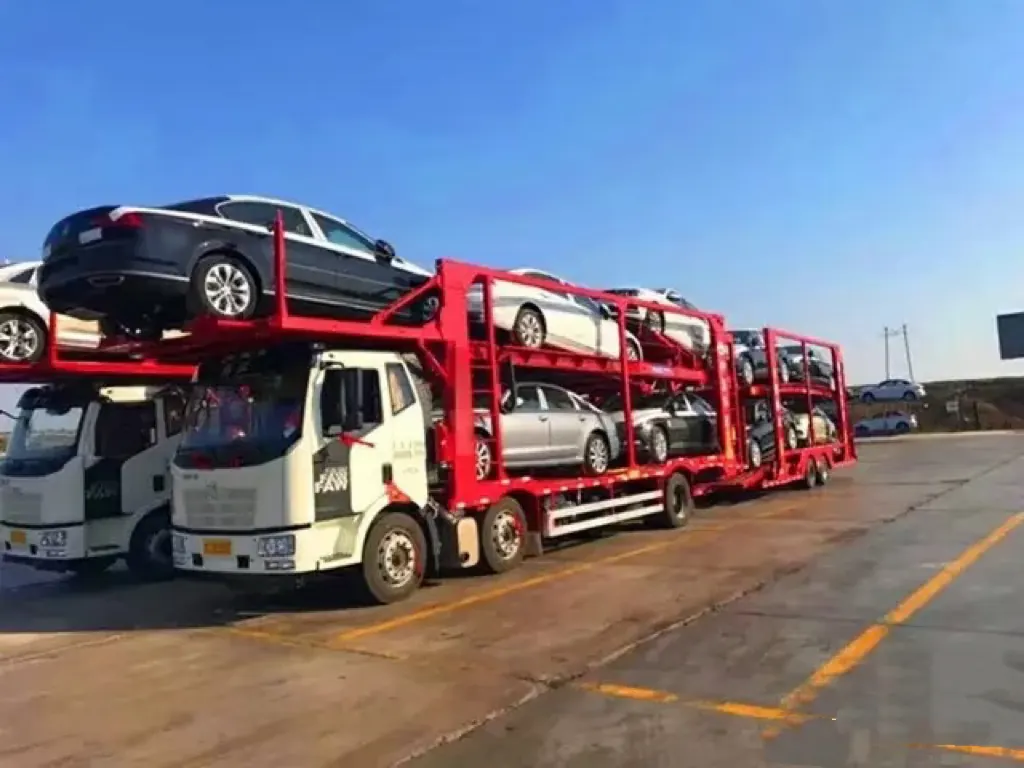 Multi-car transporter truck loaded with export vehicles