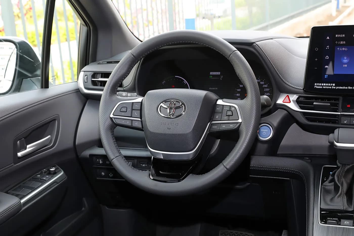 2023 Toyota Sienna — steering wheel and instrument cluster | large hybrid MPV for export