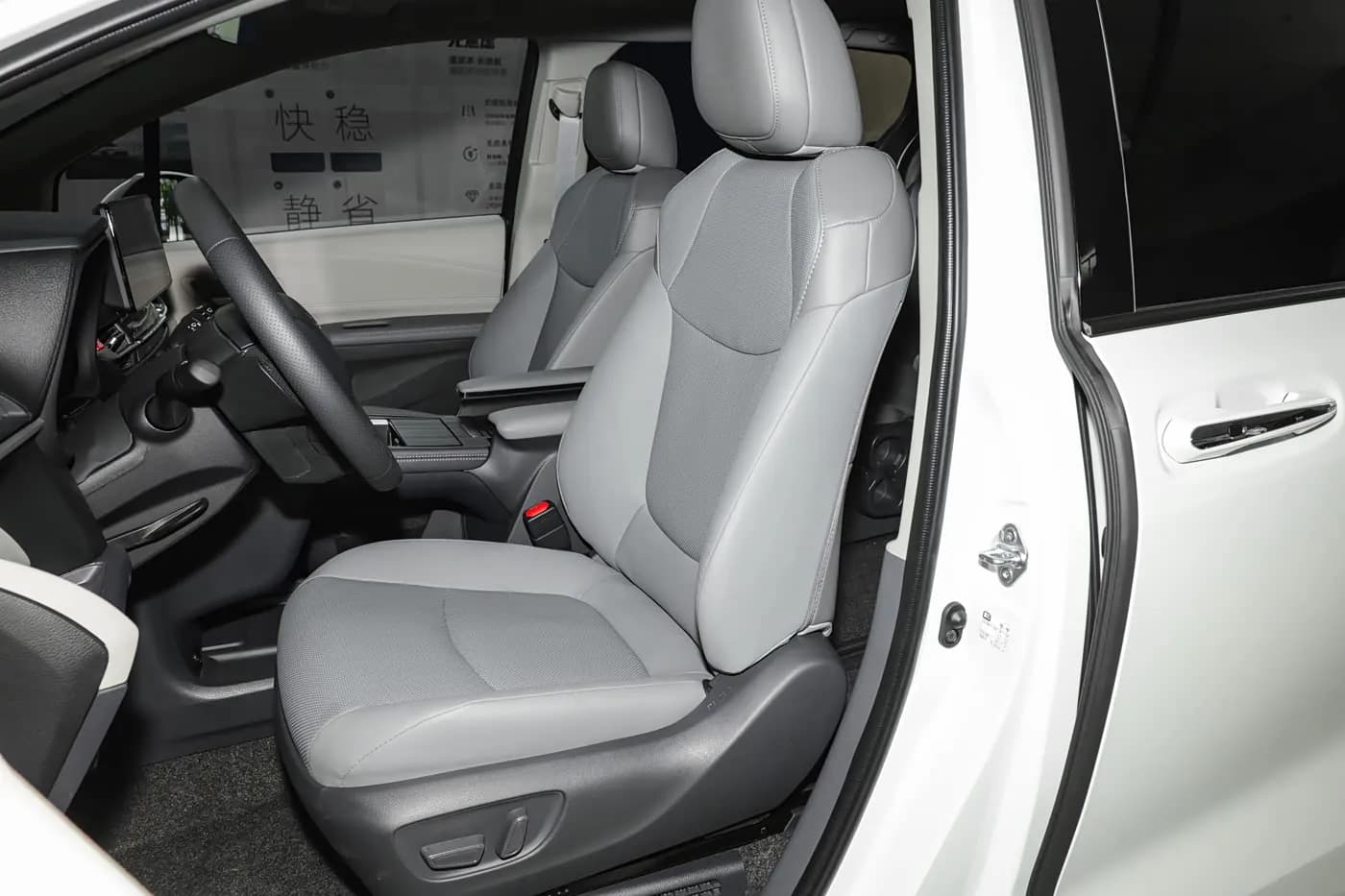 2024 Toyota Sienna — front seats | large hybrid MPV for export