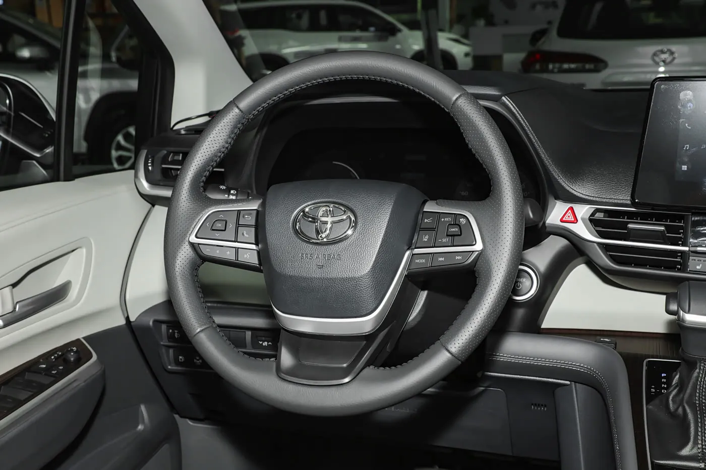 2024 Toyota Sienna — steering wheel and instrument cluster | large hybrid MPV for export