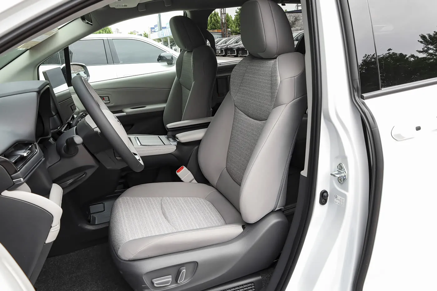 2027 Toyota Sienna — front seats | large hybrid MPV for export